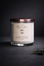 Load image into Gallery viewer, Candle labeled 'Maria James Dry Gin' on a dark background