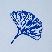 Load image into Gallery viewer, Blue leaf design on a light blue background