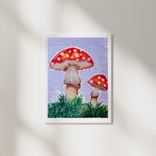Load image into Gallery viewer, Framed artwork of two red mushrooms with white spots on a blue background.