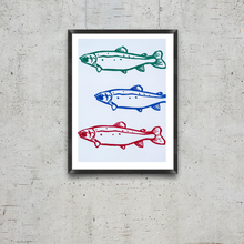 Load image into Gallery viewer, Framed artwork with three fish illustrations in green, blue, and red on a white background, mounted on a textured gray wall.
