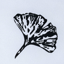 Load image into Gallery viewer, Black leaf silhouette on a light blue background
