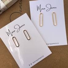 Load image into Gallery viewer, Gold-plated oval hoop stud earrings in short and long sizes on Mara James jewelry card
